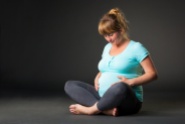 Closeup of a pregnant woman's sitting